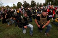 People pray during a rally of the far right group Proud Boys in Portland