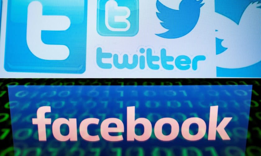 (COMBO) This combination of file pictures created on August 22, 2018 shows a photo illustration taken on March 23, 2018 of Twitter logos on a computer screen in Beijing and a file illustration picture taken on April 28, 2018 of the logo of social network Facebook displayed on a screen and reflected on a tablet in Paris. - A concerted Russian hacking and online disinformation campaign in 2016 sought to tip the US presidential election toward Donald Trump. Two weeks ahead of midterm congressional elections, Moscow's operatives are at it again. The shutdown of thousands of Russian-controlled accounts by Twitter and Facebook -- plus the indictments of 14 people from Russia's notorious troll farm the Internet Research Agency -- have blunted but by no means halted their efforts to influence US politics. (Photos by NICOLAS ASFOURI and Lionel BONAVENTURE / AFP) (Photo credit should read NICOLAS ASFOURI,LIONEL BONAVENTURE/AFP/Getty Images)