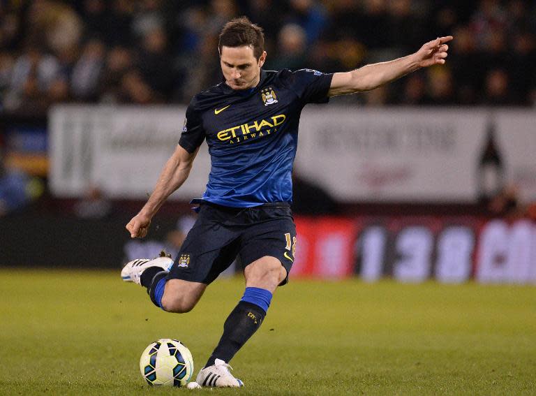 Manchester City's English midfielder Frank Lampard takes a freekick during the English Premier League football match between Burnley and Manchester City in Burnley, England, on March 14, 2015