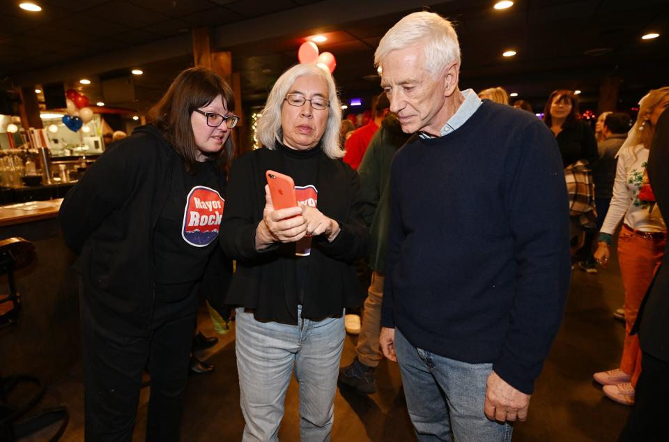 Kate Fox, Anita Abright and Rocky Anderson look at results at a watch party with supporters in Salt Lake City on Tuesday, Nov. 21, 2023. | Scott G Winterton, Deseret News