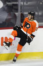 Philadelphia Flyers' Travis Konecny celebrates after scoring a goal past Buffalo Sabres goaltender Carter Hutton during the second period of an NHL hockey game, Tuesday, Jan. 19, 2021, in Philadelphia. (AP Photo/Derik Hamilton)