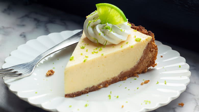 slice of key lime pie served on plate with fork