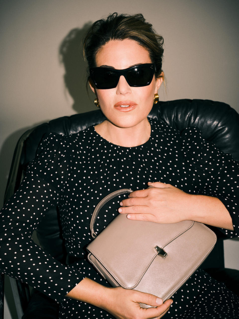 Monica Lewinsky appears in a press campaign for Reformation with a dotted dress and leather bag