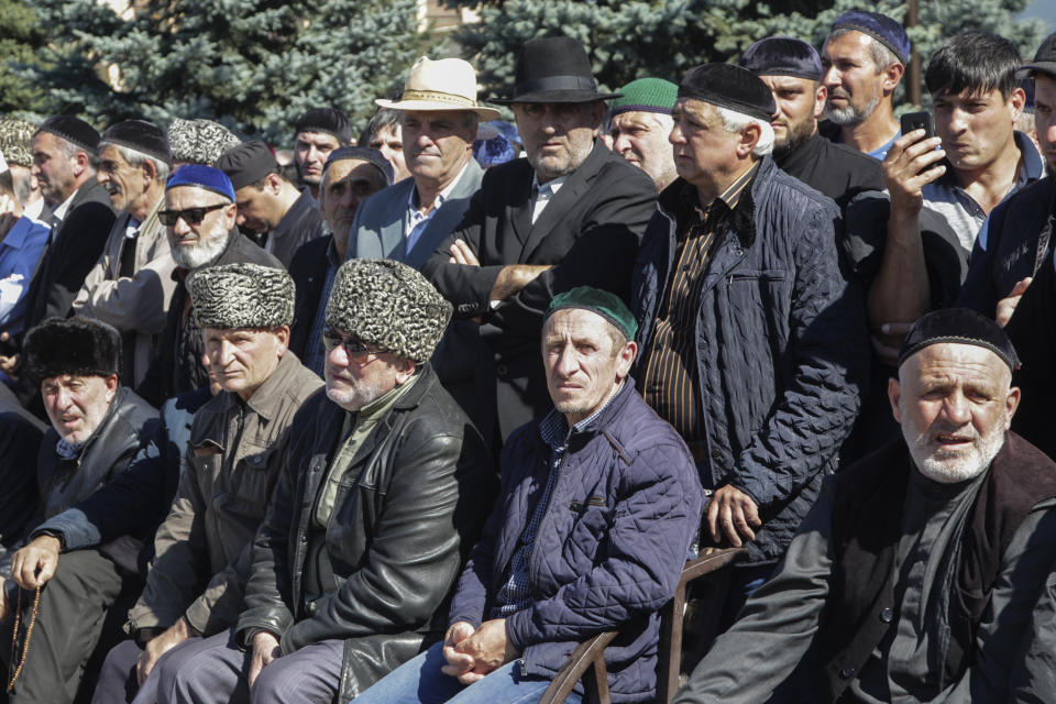 People attend a protest against the new land swap deal agreed by the heads of the Russian regions of Ingushetia and Chechnya, in Ingushetia's capital Magas, Russia, Monday, Oct. 8, 2018. Ingushetia and the neighboring province of Chechnya last month signed a deal to exchange what they described as unpopulated plots of agricultural land, but the deal triggered massive protests in Ingushetia where it was seen by many as hurting Ingushetia’s interests. (AP Photo/Musa Sadulayev)