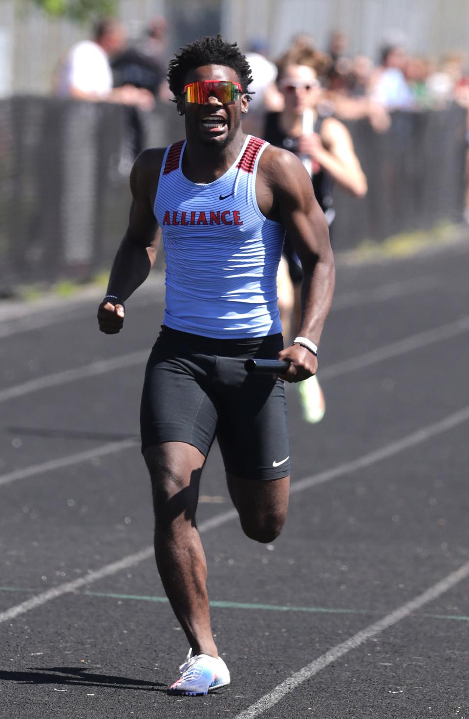 Ternino Hill anchors the 4x200 meter relay at the EBC track and field championships held at Marlington High School Saturday, May 14, 2022. 