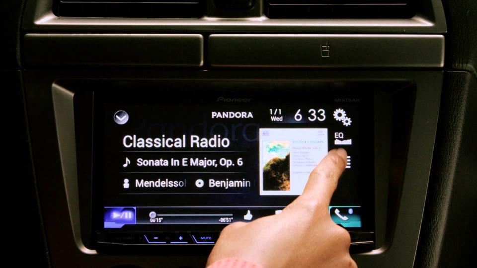 Pandora app streaming on a dashboard touchscreen.