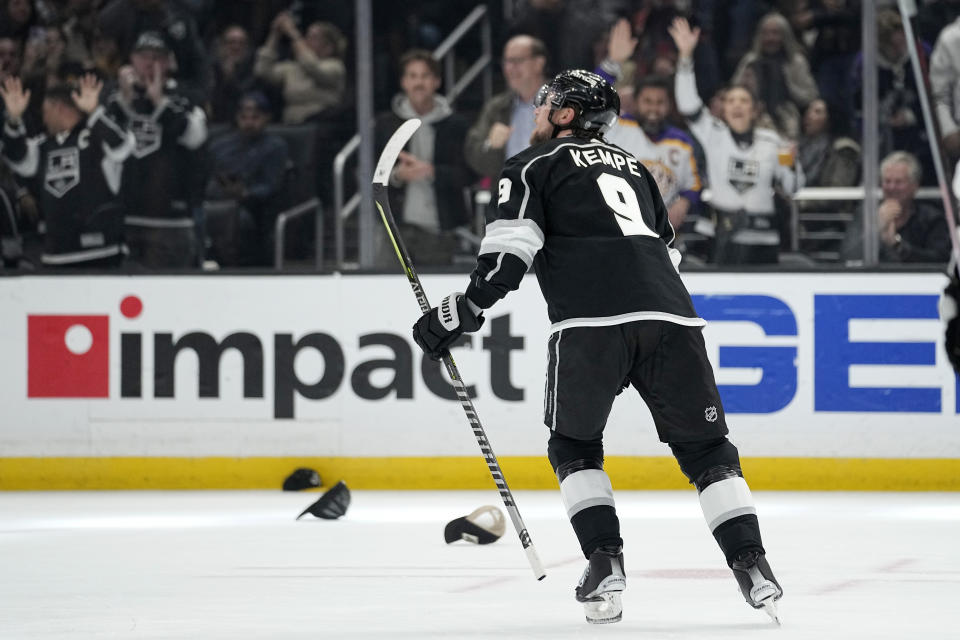 Los Angeles Kings right wing Adrian Kempe skates back to his bench after scoring his third goal of the game for a hat trick during the second period of an NHL hockey game against the Pittsburgh Penguins Saturday, Feb. 11, 2023, in Los Angeles. (AP Photo/Mark J. Terrill)