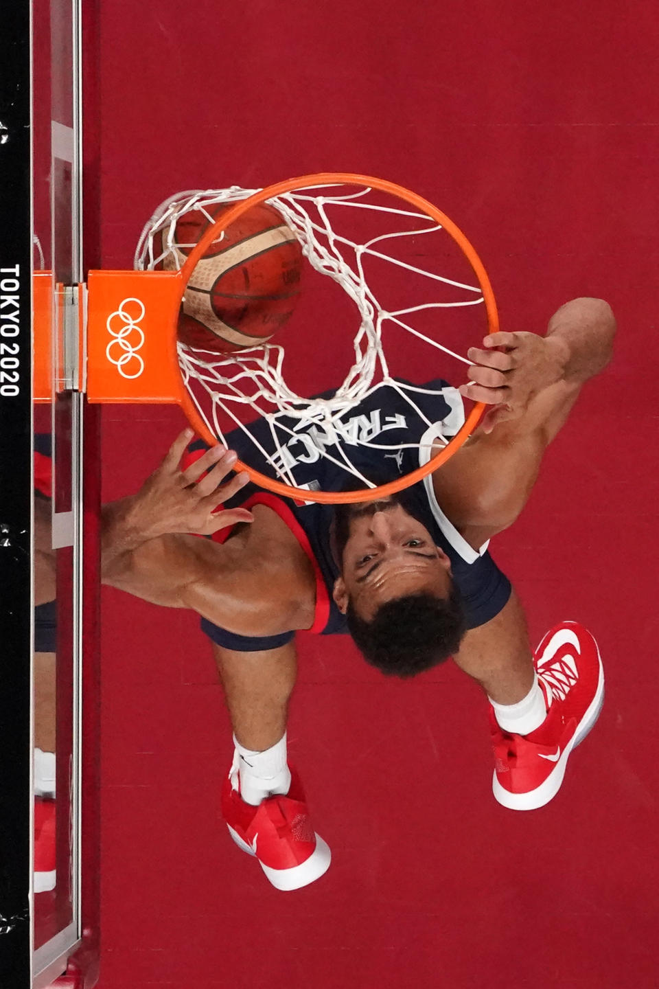 <p>France's Rudy Gobert dunks the ball in the men's preliminary round group A basketball match between Iran and France during the Tokyo 2020 Olympic Games at the Saitama Super Arena in Saitama on July 31, 2021. (Photo by Brian SNYDER / POOL / AFP)</p> 