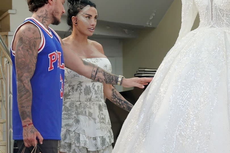 Kaite Price and JJ Slater looking at wedding dresses