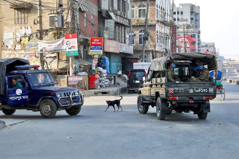 Members of the Bangladesh Army are seen on a vehicle, patrolling during countrywide lockdown for coronavirus disease (COVID-19) outbreak in Dhaka