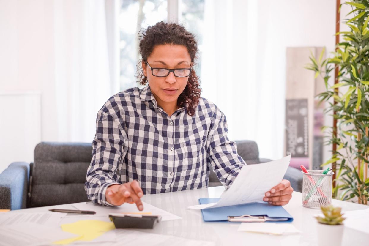 Black woman working from home with computer laptop