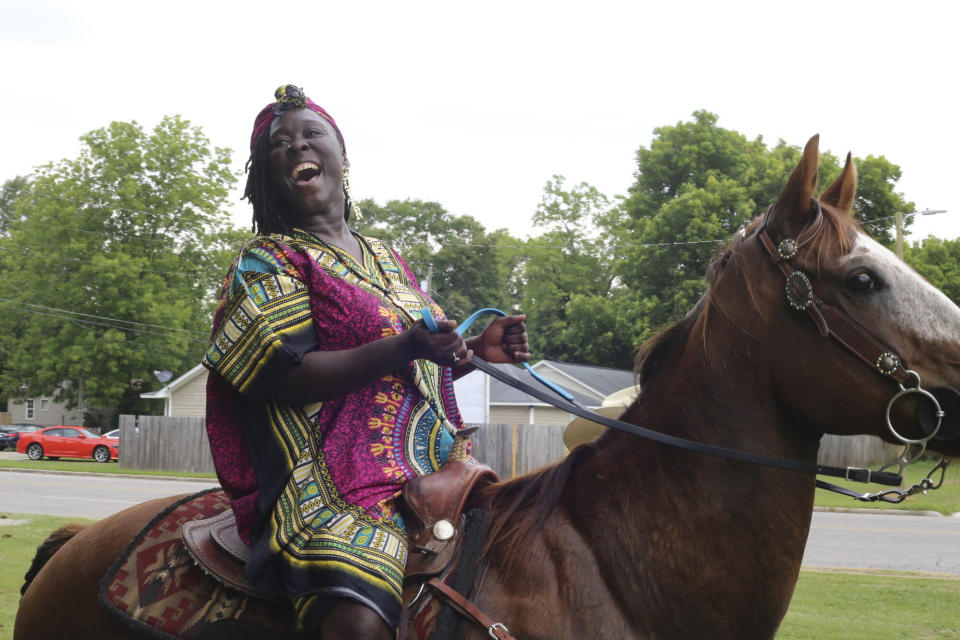 FILE - Brittany Martin, founder of Mixed Sistaz United, rides a horse at the organization's inaugural Juneteenth celebration in 2021, in Sumter, S.C. Martin, a pregnant Black activist serving four years in prison over comments she made to police during racial justice protests in the summer of 2020, will not receive a lesser sentence, a judge has ruled. (The Item via AP, File)
