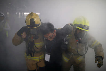 South Korean firefighters take part in an anti-terror drill as a part of the Ulchi Freedom Guardian exercise in Seoul, South Korea, August 23, 2017. REUTERS/Kim Hong-Ji