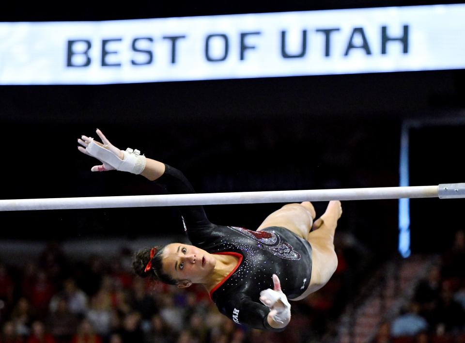 Utah’s Amelie Morgan reaches for the higher bar during her routine as BYU, Utah, SUU and Utah State meet in the Rio Tinto Best of Utah Gymnastics competition at the Maverick Center in West Valley City on Monday, Jan. 15, 2024. | Scott G Winterton, Deseret News