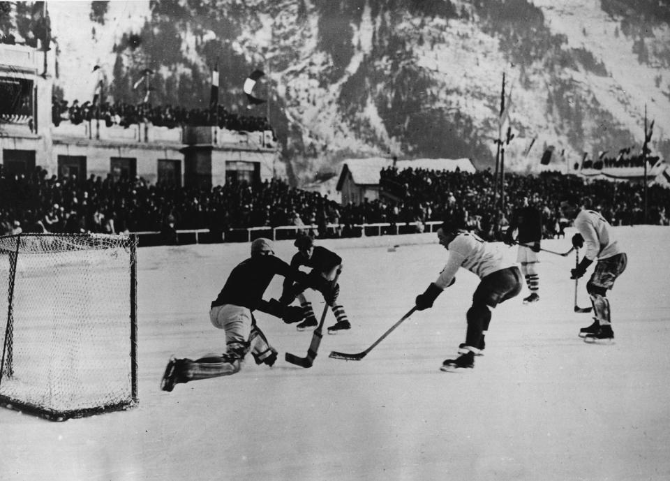 <p>The Canadian team <a href="https://olympics.com/en/olympic-games/chamonix-1924" rel="nofollow noopener" target="_blank" data-ylk="slk:scored a whopping 122 goals;elm:context_link;itc:0;sec:content-canvas" class="link ">scored a whopping 122 goals</a> throughout the Winter Games, only allowing three to be scored against them. </p> <p>Pictured: Team USA faces off with Team Canada during an ice hockey match. </p>