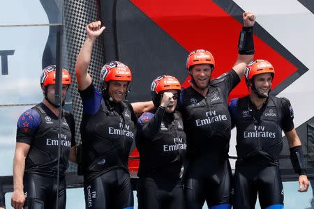 Sailing - America's Cup finals - Hamilton, Bermuda - June 26, 2017 - Peter Burling, Emirates Team New Zealand Helmsman celebrates with his team after defeating Oracle Team USA in race nine to win the America's Cup. REUTERS/Mike Segar