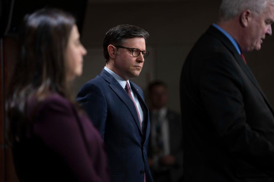 House Speaker Mike Johnson of La., center, listens as House Majority Whip Tom Emmer of Minn., right, speaks during a press conference on Capitol Hill, Tuesday, Jan. 30, 2024 in Washington.