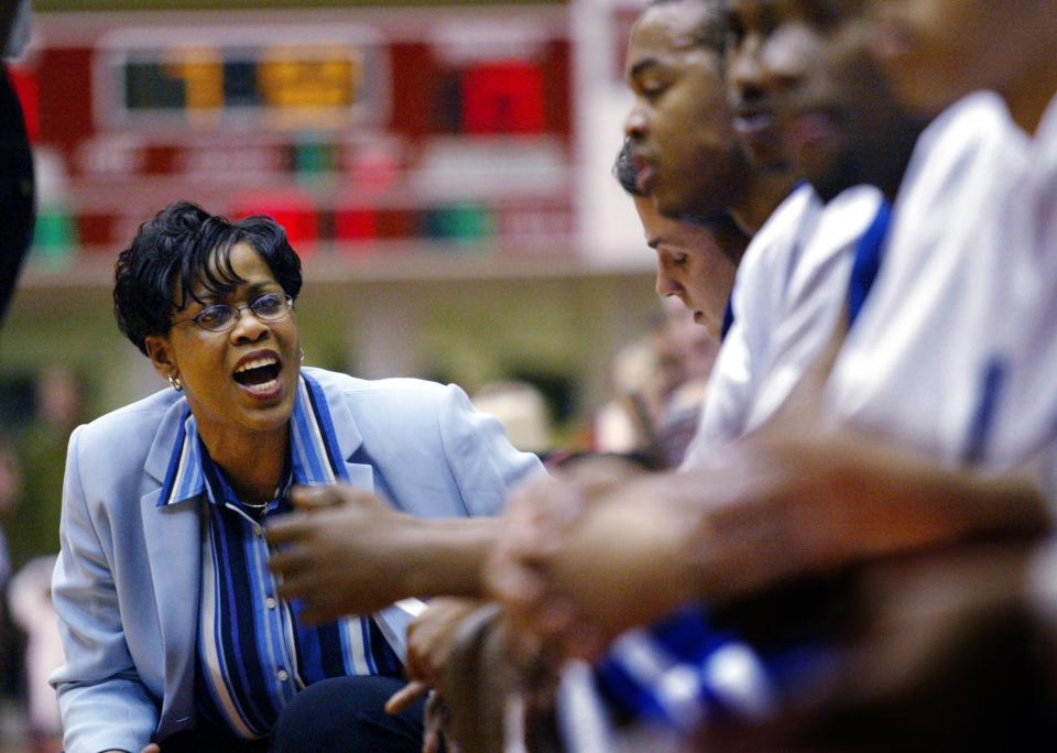 Tennessee State University Athletic Director Teresa Phillips gives words of encouragement to her players as they compete against Austin Peay State University in Clarksville, Tenn., Feb. 13, 2003. Phillips appointed herself acting head coach for the game after the one-game suspension of interim head coach Hosea Lewis and became the first woman to coach a men's Division I basketball team.