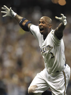 Nyjer Morgan celebrates his game-winning hit before being mobbed by teammates as the Brewers beat the Diamondbacks 3-2 to advance to the NLCS