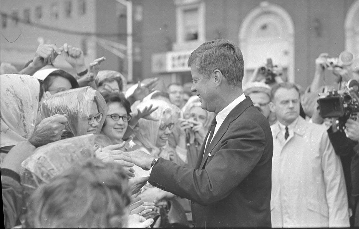 President John F. Kennedy shaking hands and speaking with the crowd outside Hotel Texas in downtown Fort Worth, 11/22/1963