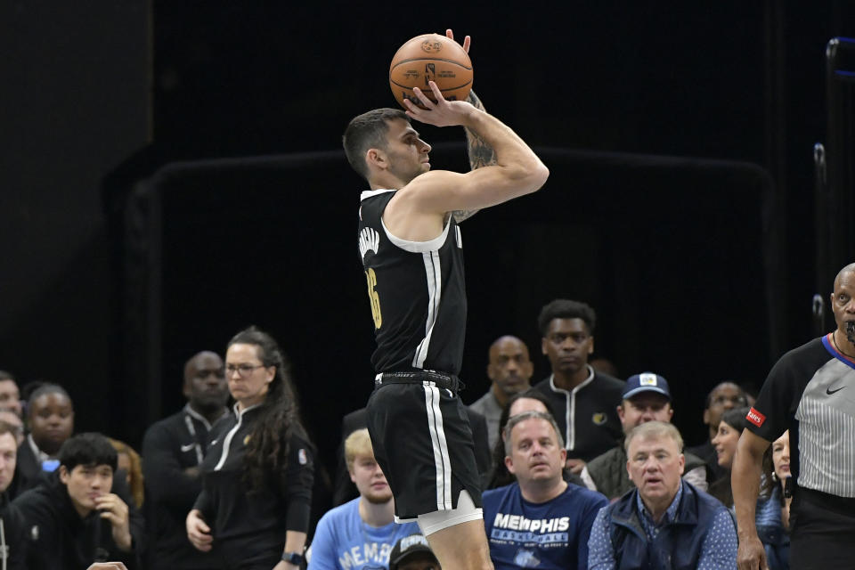 Memphis Grizzlies guard John Konchar shoots against the Atlanta Hawks during the first half of an NBA basketball game Friday, March 8, 2024, in Memphis, Tenn. (AP Photo/Brandon Dill)