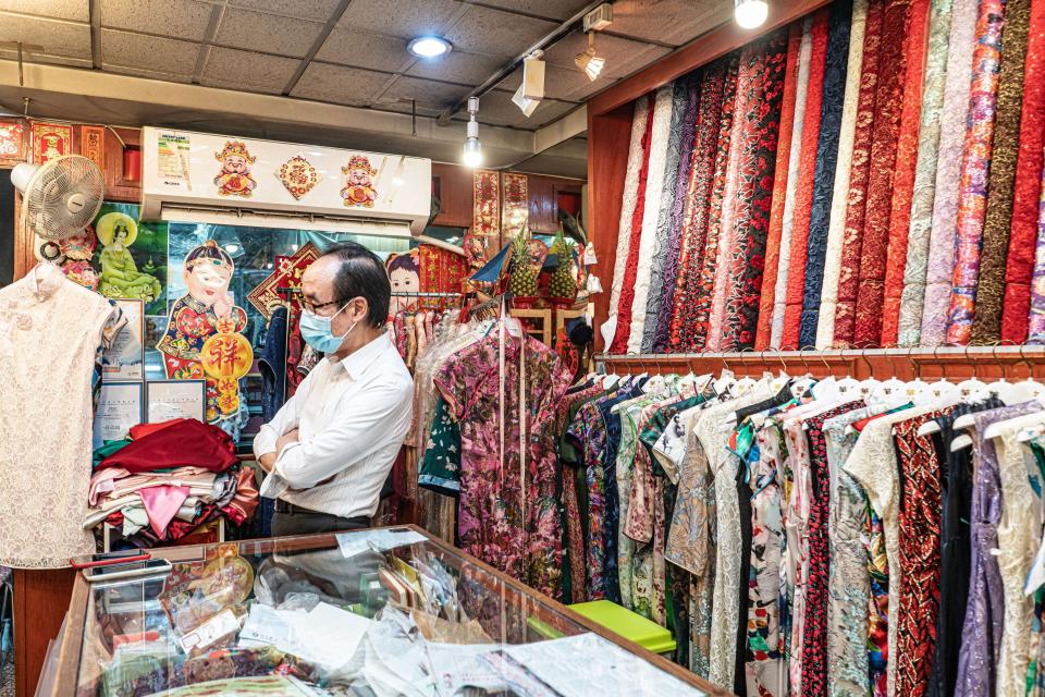 A picture of a cheongsam maker in Hong Kong and his shop