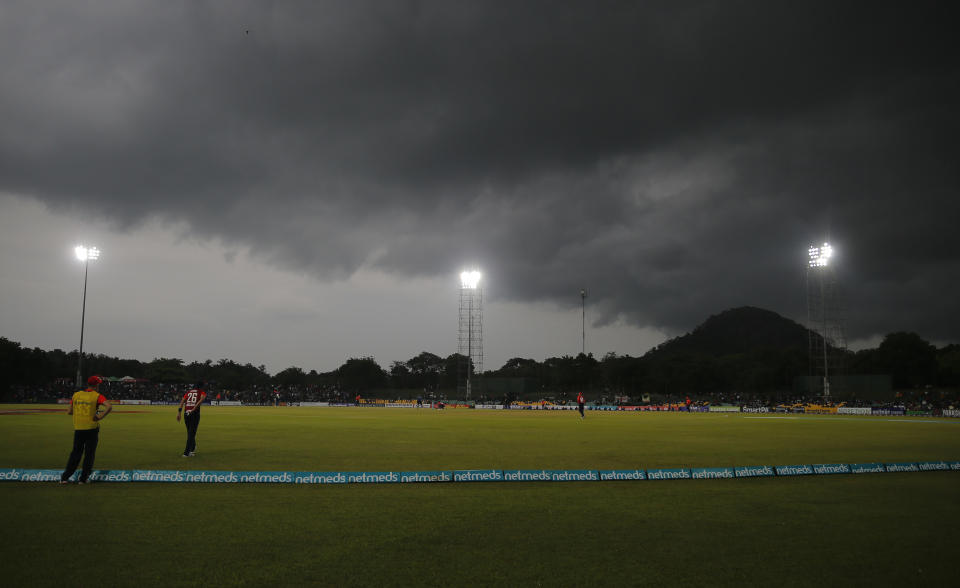 Rain clouds hover in the sky over Rangiri Dambulla Stadium during the second one-day international cricket match in Dambulla, Sri Lanka, Saturday, Oct. 13, 2018. (AP Photo/Eranga Jayawardena)