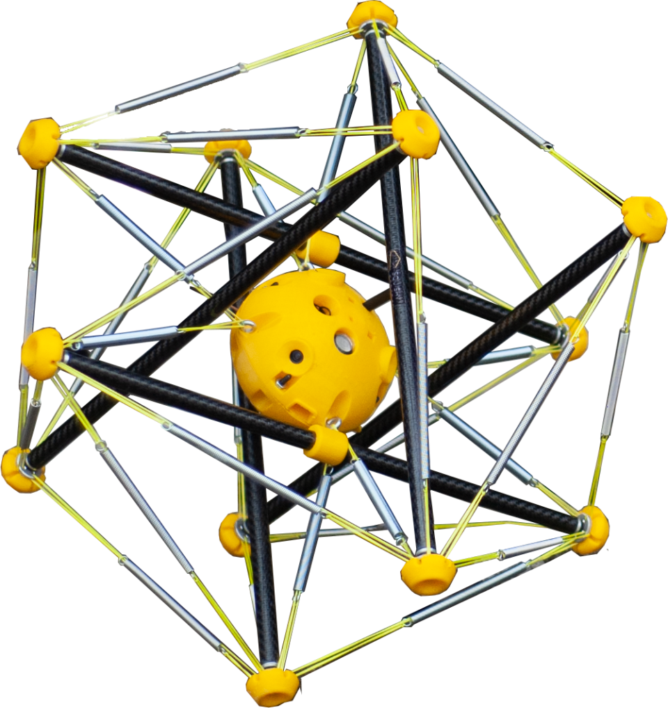 A close-up of the squishy robot, which looks like a yellow ball surrounded by many poles of a frame that forms a prism around the center.