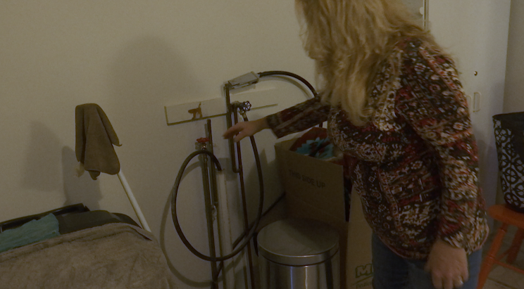Justina Cowan said she’s been living in a house with no running water for more than a month. (WLNS)