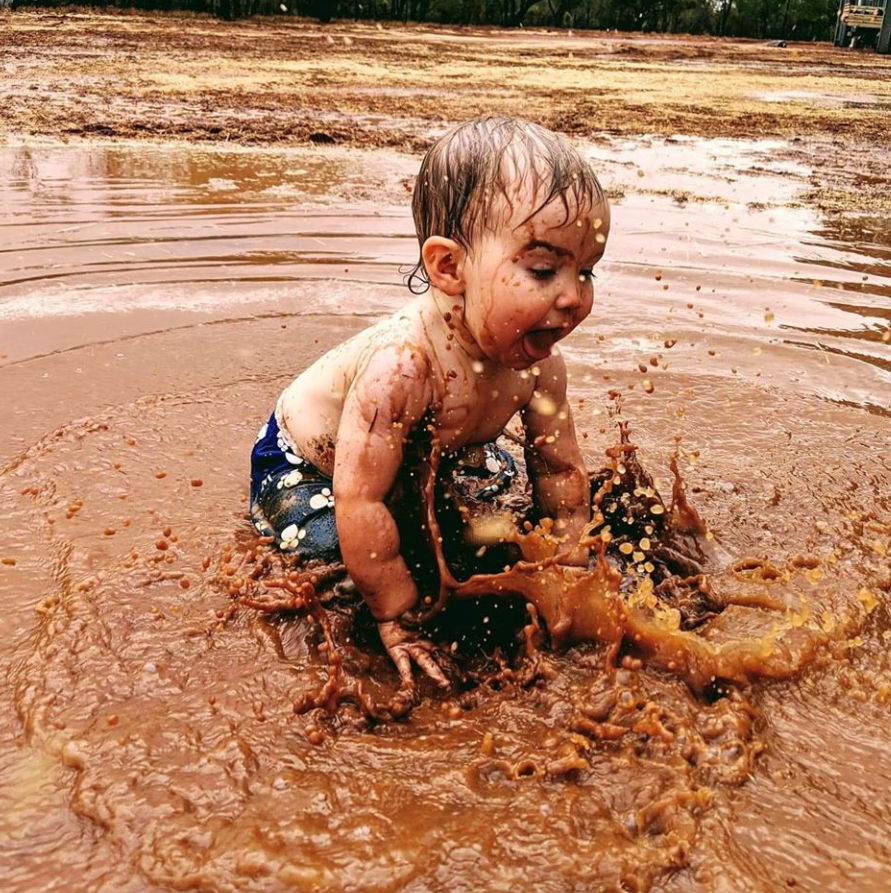 Lacey can be seen splashing in puddles. Source: Emma Sewell