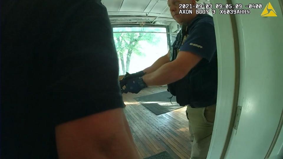 Knox County Sheriff's Office body camera footage shows fire investigator Jerry Glenn during a 2021 raid. Glenn's body camera is visible in the video.