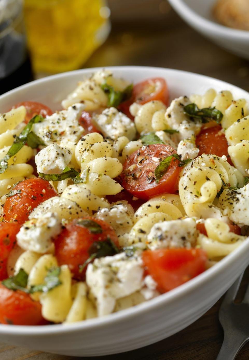 <p>Bring this pasta salad to a picnic, barbecue or potluck - with large chunks of ripe tomatoes, fresh basil, tangy red onion, and dried oregano, it's super satisfying.<br></p><p><strong><a rel="nofollow noopener" href="https://www.womansday.com/food-recipes/food-drinks/recipes/a11221/tomato-basil-pasta-salad-recipe-122548/" target="_blank" data-ylk="slk:Get the recipe.;elm:context_link;itc:0;sec:content-canvas" class="link ">Get the recipe.</a></strong></p>