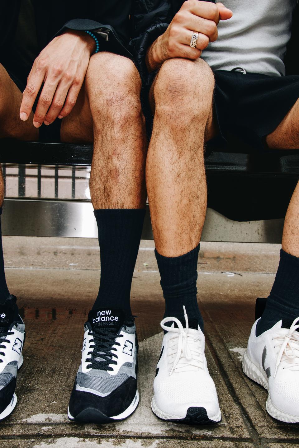 <cite class="credit"><em>Left:</em> Sneakers, $365, by Junya Watanabe x New Balance / Blazer, $3,160, by Rick Owens Larry Fall/Winter 2019 / Shorts, model's own / Socks, $4, by Uniqlo / Bracelet, model's own | <em>Right:</em> Sneakers, $300, by Veja x Rick Owens / Tank top, $244, and shorts, $1,940, by Rick Owens Larry Fall/Winter 2019 / Socks, $4, by Uniqlo / Ring, models own</cite>