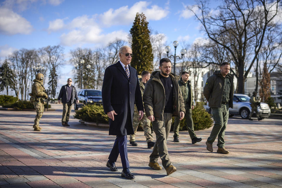 Image: President Joe Biden, left, walks with Ukrainian President Volodymyr Zelenskyy during an unannounced visit, in Kyiv, Ukraine on Feb. 20, 2023.  (Evan Vucci / AP)