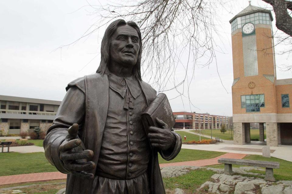 A statue of Roger Williams at the namesake university.