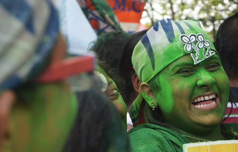 <p>Indian Trinamool Congress (TMC) supporters celebrate victory in the West Bengal state assembly elections in Kolkata on May 19, 2016. Vote-counting is takaing place following state assembly elections in Tamil Nadu, Kerala and Pondicherry. The makeup of India’s next government could lie in the hands of a trio of women who command a massive following in their regional heartlands, including a populist former movie star known as “Mother” to supporters. </p>