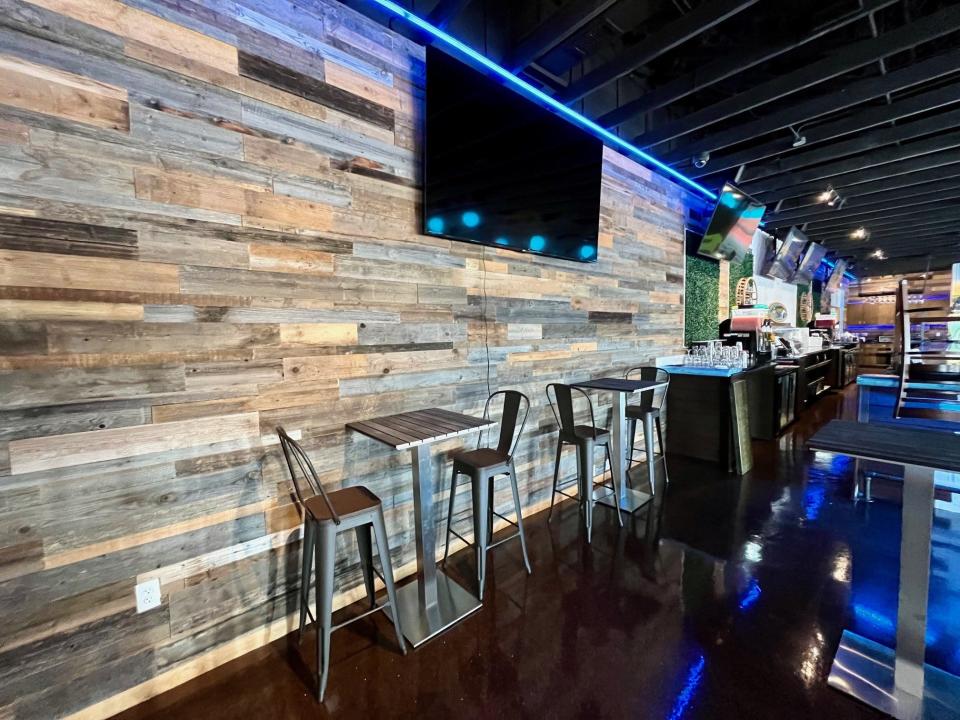 A wall blocks the view to the former brewery area at Hooked Island Grill.