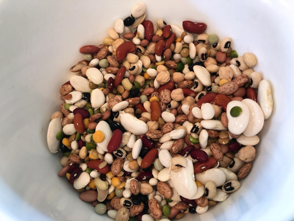 This April 1, 2020 photo shows dried mixed beans being prepared for a stone soup recipe in Amagansett, N.Y. Almost anything tastes good with beans. You can add what you have in the house like mushrooms, potatoes and corn to the soup. (Elizabeth Karmel via AP)