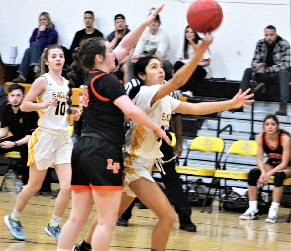 Myah Abeyta of Pueblo East drives past her defender from Lewis-Palmer in a match up at Pueblo East High School on Jan. 7, 2023.