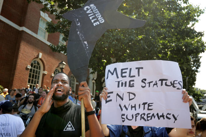 <p>Counter-protesters line the route taken by white nationalists, neo-Nazis and members of the ‘alt-right’ during the ‘Unite the Right’ rally August 12, 2017 in Charlottesville, Virginia. After clashes with anti-fascist protesters and police the rally was declared an unlawful gathering and people were forced out of Lee Park, where a statue of Confederate General Robert E. Lee is slated to be removed. (Photo: Chip Somodevilla/Getty Images)<br></p>