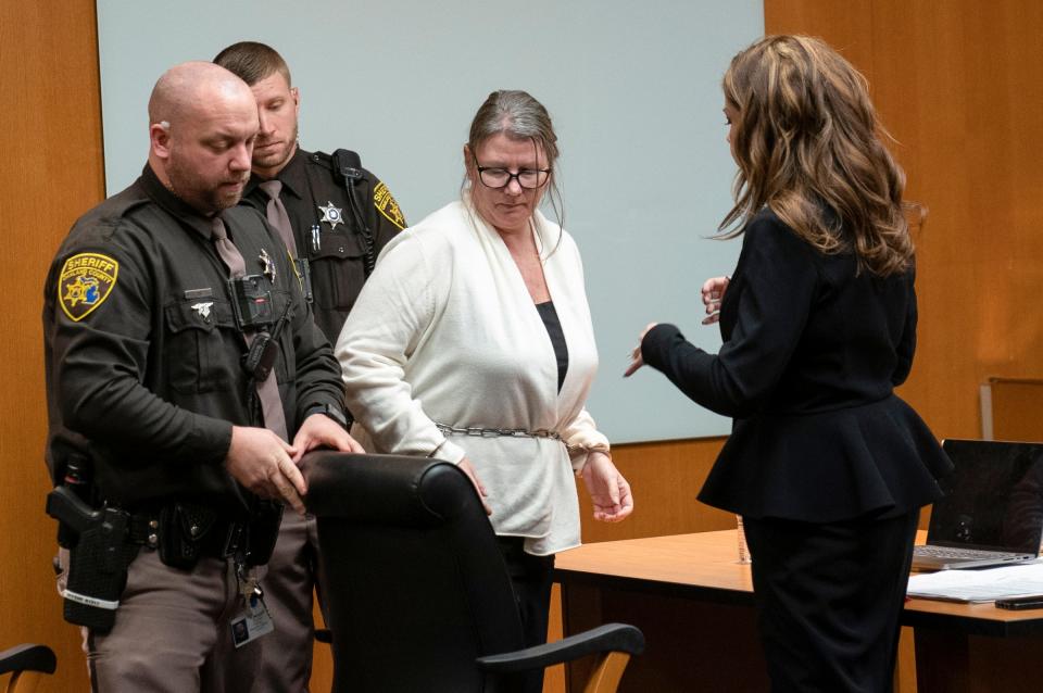 Jennifer Crumbley is led from the Oakland County courtroom of Cheryl Matthews on Monday Feb. 5, 2024, as she waits for the jury to deliberate on four counts of involuntary manslaughter for the four students killed by her son, Ethan Crumbley, in a 2021 shooting at Oxford High School. Crumbley was in the courtroom for a jury question.