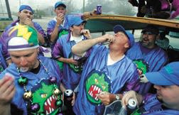 02/17/06 - Neaux Fear Float Captain Nelson Kramer (center), of Houma, part of the Krewe of Hercules, throws back jello-shots with krewe members after a hearty breakfast at the Jolly Inn on Barrow Street early Friday morning.
