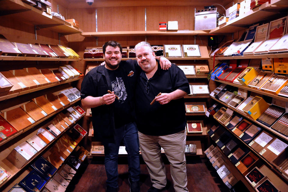 Michael and Mike Heidelman inside their bank vault humidor at their new Wooster business, The Cigar Vault, which opens in mid-June.