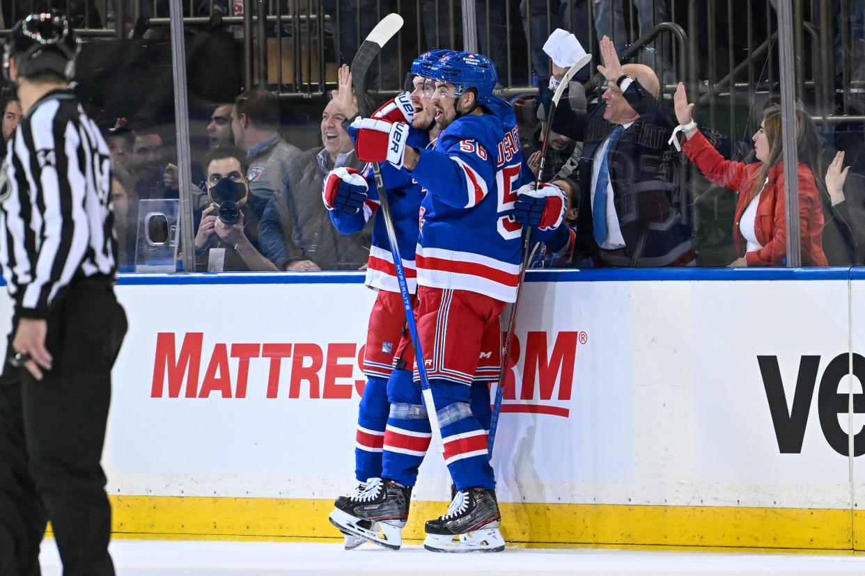 Apr 23, 2024; New York, New York, USA; New York Rangers center Jack Roslovic (96) celebrates his goal against the Washington Capitals with New York Rangers defenseman Erik Gustafsson (56) during the second period in game two of the first round of the 2024 Stanley Cup Playoffs at Madison Square Garden. Mandatory Credit: Dennis Schneidler-USA TODAY Sports