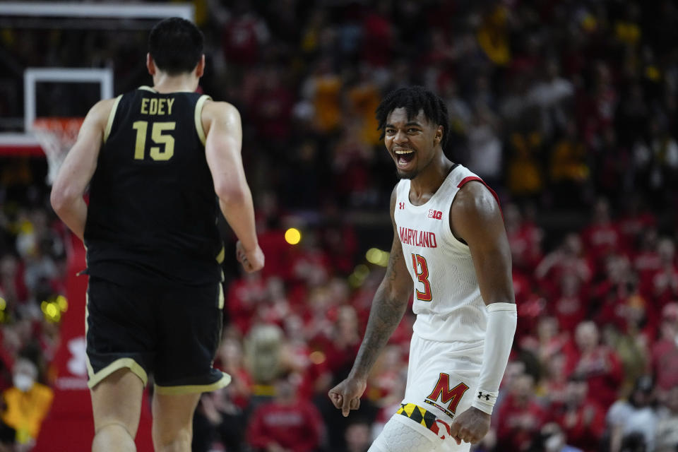 Maryland guard Hakim Hart (13) reacts after a basket as Purdue center Zach Edey (15) runs by during the second half of an NCAA college basketball game, Thursday, Feb. 16, 2023, in College Park, Md. Maryland won 68-54. (AP Photo/Julio Cortez)