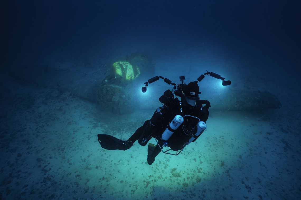 A diver swims above the wreckage of a U.S. Marine Corps Douglas AD-5 Skyraider plane sitting at the bottom of the ocean off Key Biscayne.