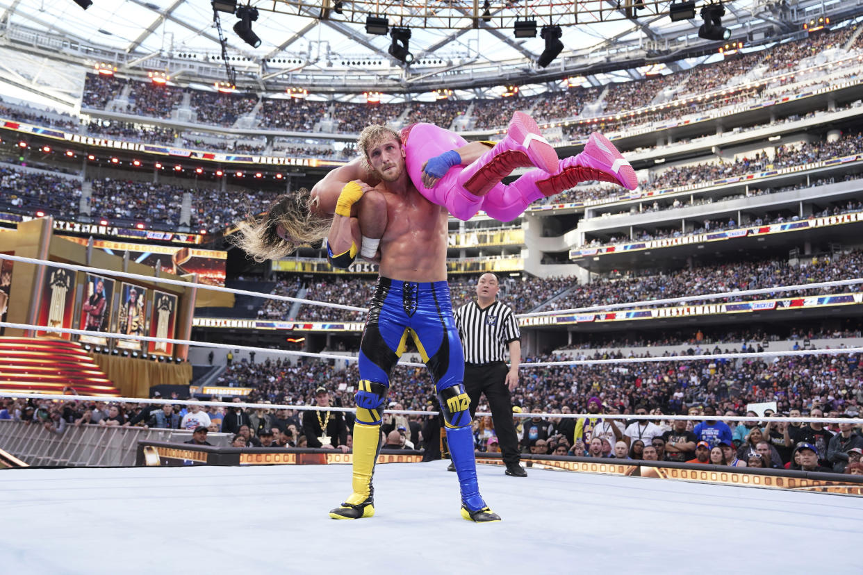 In this photo provided by WWE, social media star Logan Paul faces Seth Rollins during WrestleMania 39 on Saturday, April 1, 2023, at SoFi Stadium in Inglewood, Calif. This was the second straight year Paul was in a match in WWE's signature event. (WWE via AP)