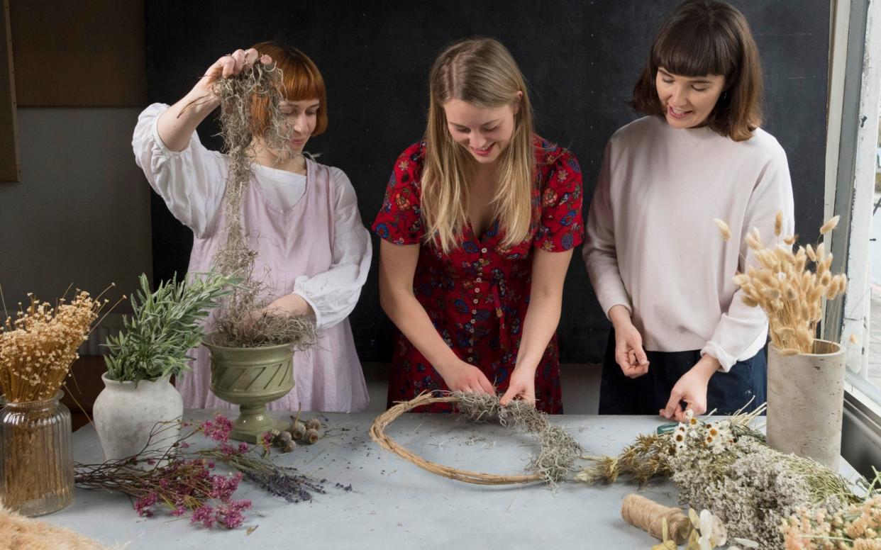 A clematis vine and a bed of moss is the starting point for an ever-evolving wreath bedecked with natural materials - Geoff Pugh for the Telegraph