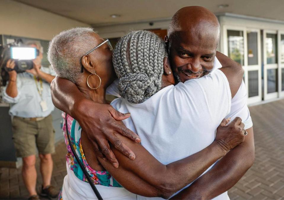 Sidney Holmes, 57 is hugged by his aunt Georgia Adams and his mother, Mary Holmes, after being released from the Main Jail Bureau, a maximum security facility adjacent to the Broward County Courthouse in downtown Fort Lauderdale on Monday, March 13, 2023.