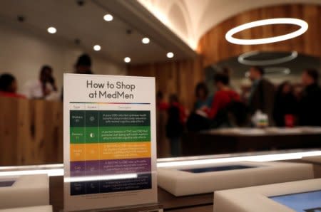 A notice board is seen near customers waiting to purchase products inside MedMen, a California-based cannabis company store serving medical prescription patients with cannabis products, on the store's opening day on 5th Avenue in Manhattan in New York City, U.S., April 20, 2018. REUTERS/Mike Segar